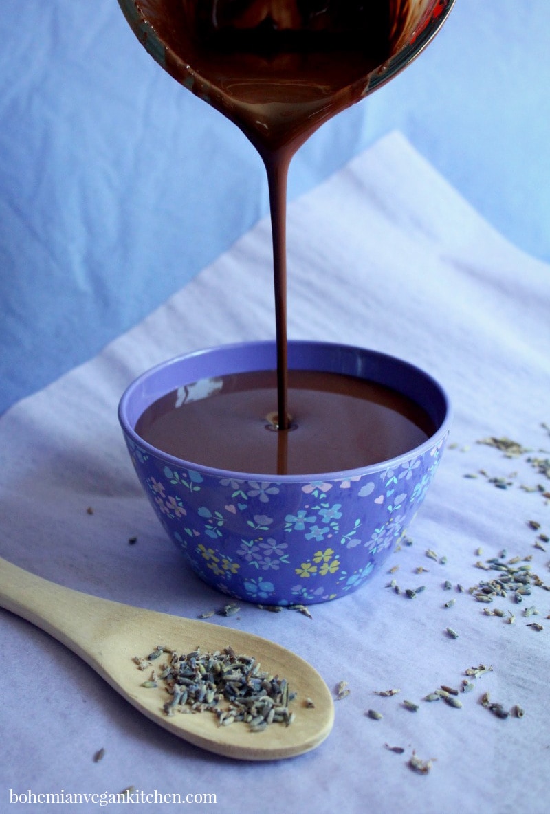 Be your own Willy Wonka and make this HEAVENLY vegan chocolate fondue, which is infused with healing lavender. Great for stress relief, anxiety, or just for kicks. This fondue is 100% vegan, and naturally gluten-free, nut-free, and soy-free. #veganchocolatefondue #veganchocolatefonduerecipe #veganchocolatefonduedairyfree #chocolatefonduerecipe #lavenderchocolate #bohemianvegankitchen