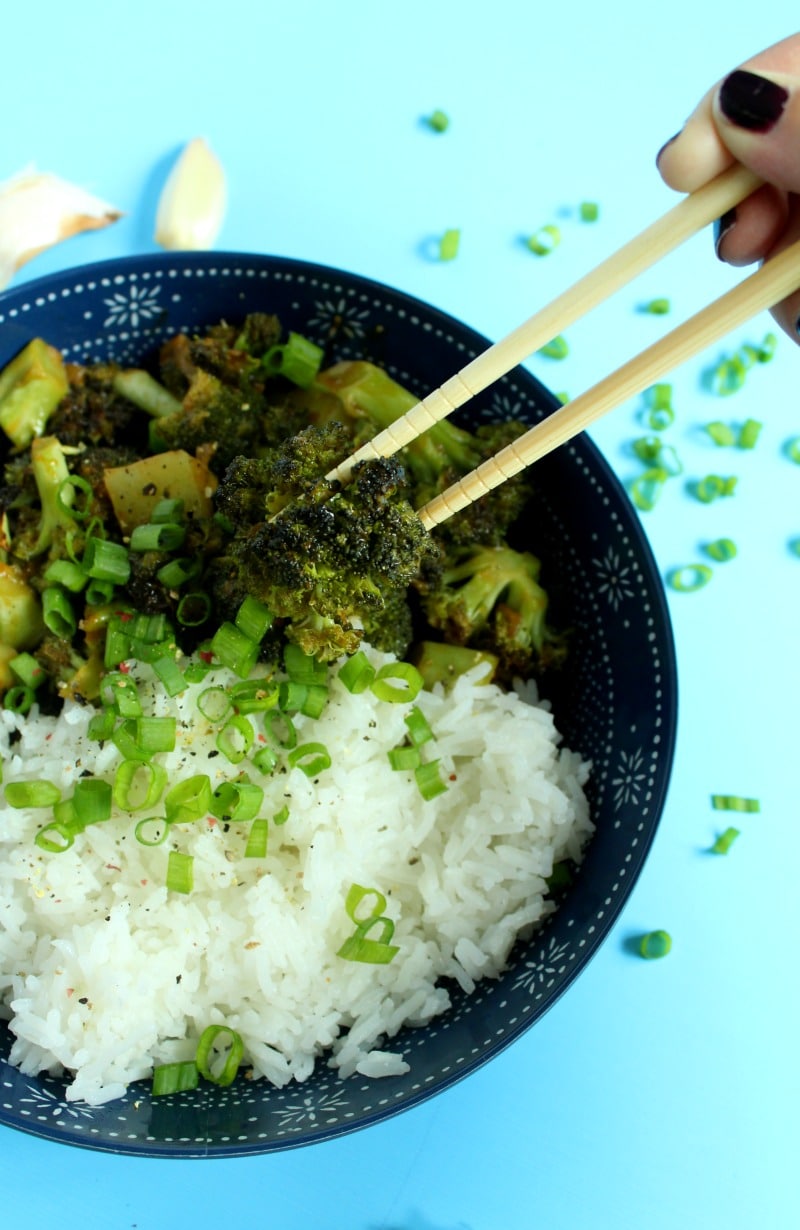 picture of picking up broccoli with chopsticks