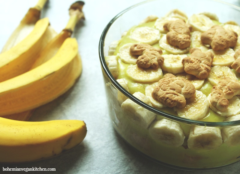 Dairy-free banana pudding is simple to pull together, but this version utilizes the natural sweetness of bananas and maple syrup as a healthy alternative to processed sugars, plus contains NO artificial coloring like traditional boxed banana pudding. Make it gluten-free (and 100% cruelty-free!) by using gluten-free + vegan animal crackers instead of traditional vanilla wafers. #dairyfreebananapudding #dairyfreebananapuddingmaplesyrup #veganbananapudding #veganbananapuddingrecipe #veganbananapuddinghealthy #bohemianvegankitchen