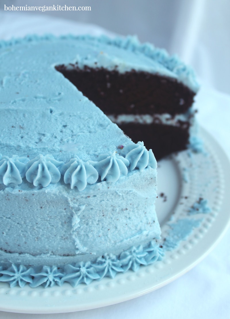 chocolate cake cut, with vegan buttercream frosting