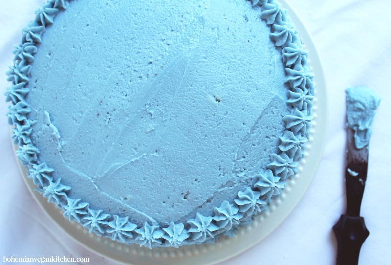 overhead shot of allergen free birthday cake with dreamy buttercream frosting on top. 