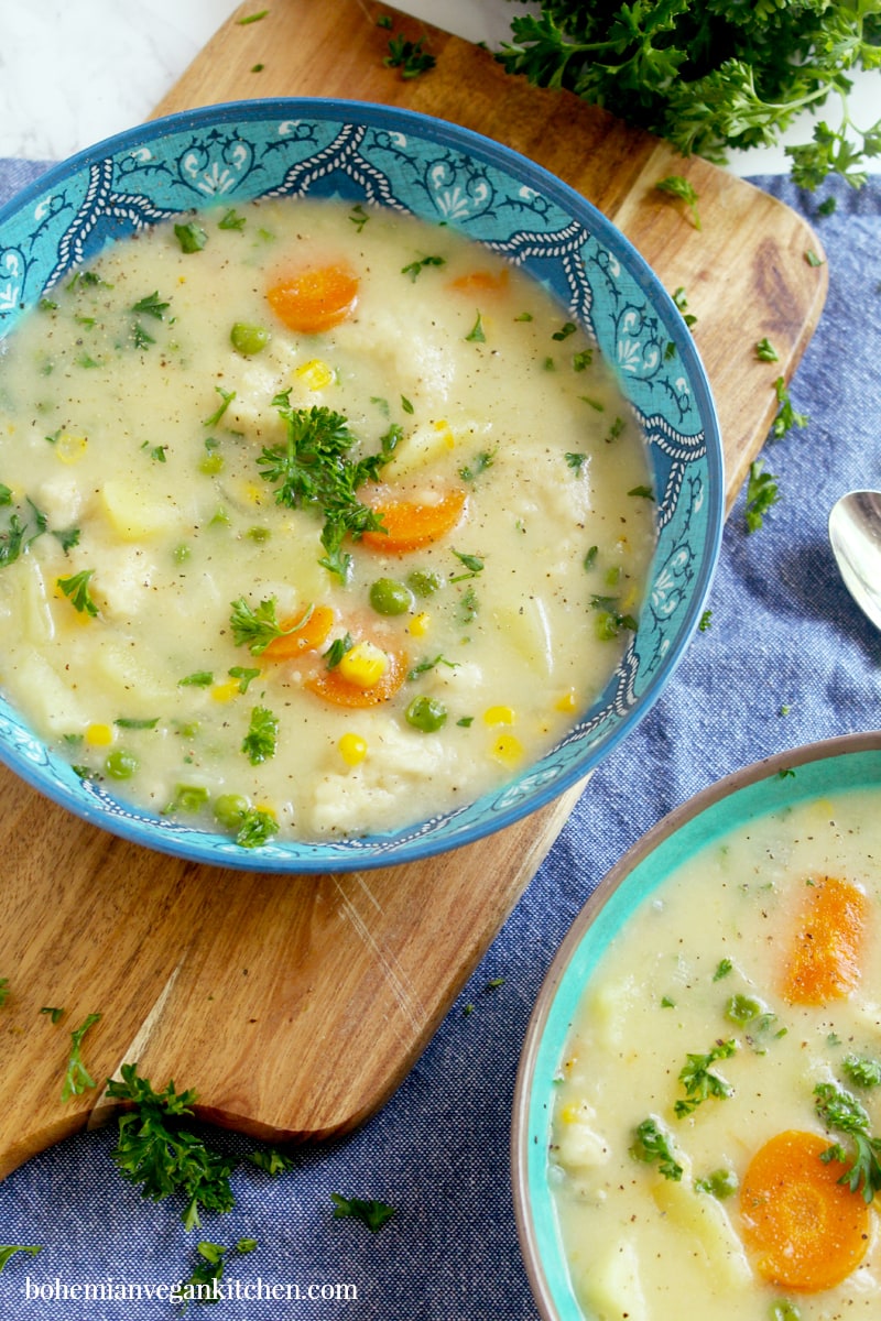 Enjoy a cozy night in with this simple vegan not-chicken and dumplings stew, which contains a delicious blend of winter veggies + LITERALLY BREAD straight in your soup bowl. Easy to make and absolutely nothing to roll out, this stew is the perfect ending to a long day. #veganchickenanddumplings #veganchickenanddumplingssoup #veganstewrecipes #vegansoup #veganfamilymeals #veganwinterrecipes #bohemianvegankitchen