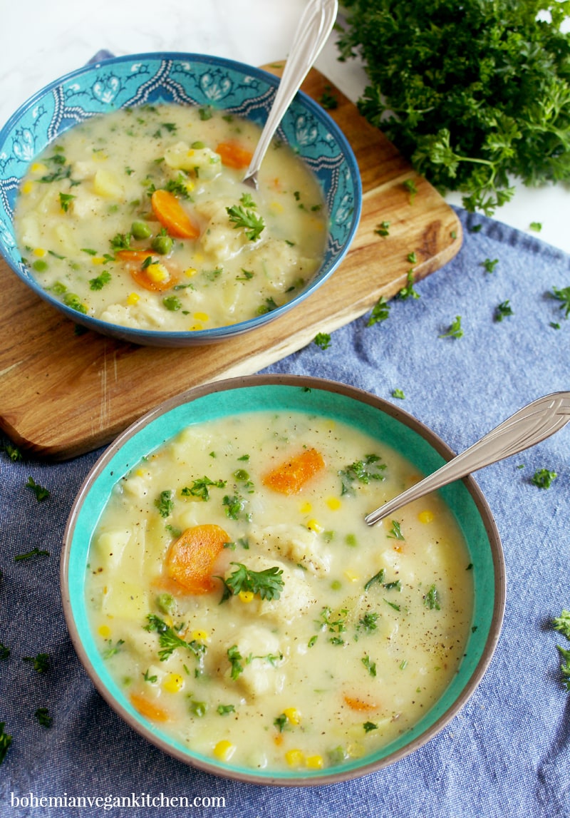Enjoy a cozy night in with this simple vegan not-chicken and dumplings stew, which contains a delicious blend of winter veggies + LITERALLY BREAD straight in your soup bowl. Easy to make and absolutely nothing to roll out, this stew is the perfect ending to a long day. #veganchickenanddumplings #veganchickenanddumplingssoup #veganstewrecipes #vegansoup #veganfamilymeals #veganwinterrecipes #bohemianvegankitchen