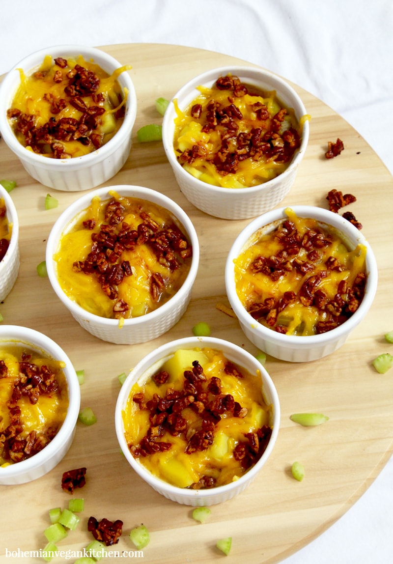 It's easy to become obsessed with this vegan baked potato soup, which is loaded down with melty dairy-free cheese and healthy homemade bacon bits! A snap to make, this soup is perfect for families and soup addicts, as each person gets their very own ramekin. Naturally vegan, this soup is meat-free, dairy-free, egg-free, and gluten-free. #veganbakedpotatosoup #veganbakedpotatosoupdairyfree #veganpotatosoup #veganpotatosoupeasy #veganbakedpotatosouprecipes #veganbakedpotatosouphealthy #bohemianvegankitchen