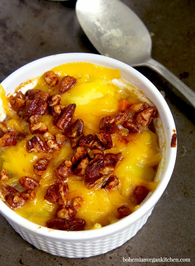 It's easy to become obsessed with this vegan baked potato soup, which is loaded down with melty dairy-free cheese and healthy homemade bacon bits! A snap to make, this soup is perfect for families and soup addicts, as each person gets their very own ramekin. Naturally vegan, this soup is meat-free, dairy-free, egg-free, and gluten-free. #veganbakedpotatosoup #veganbakedpotatosoupdairyfree #veganpotatosoup #veganpotatosoupeasy #veganbakedpotatosouprecipes #veganbakedpotatosouphealthy #bohemianvegankitchen