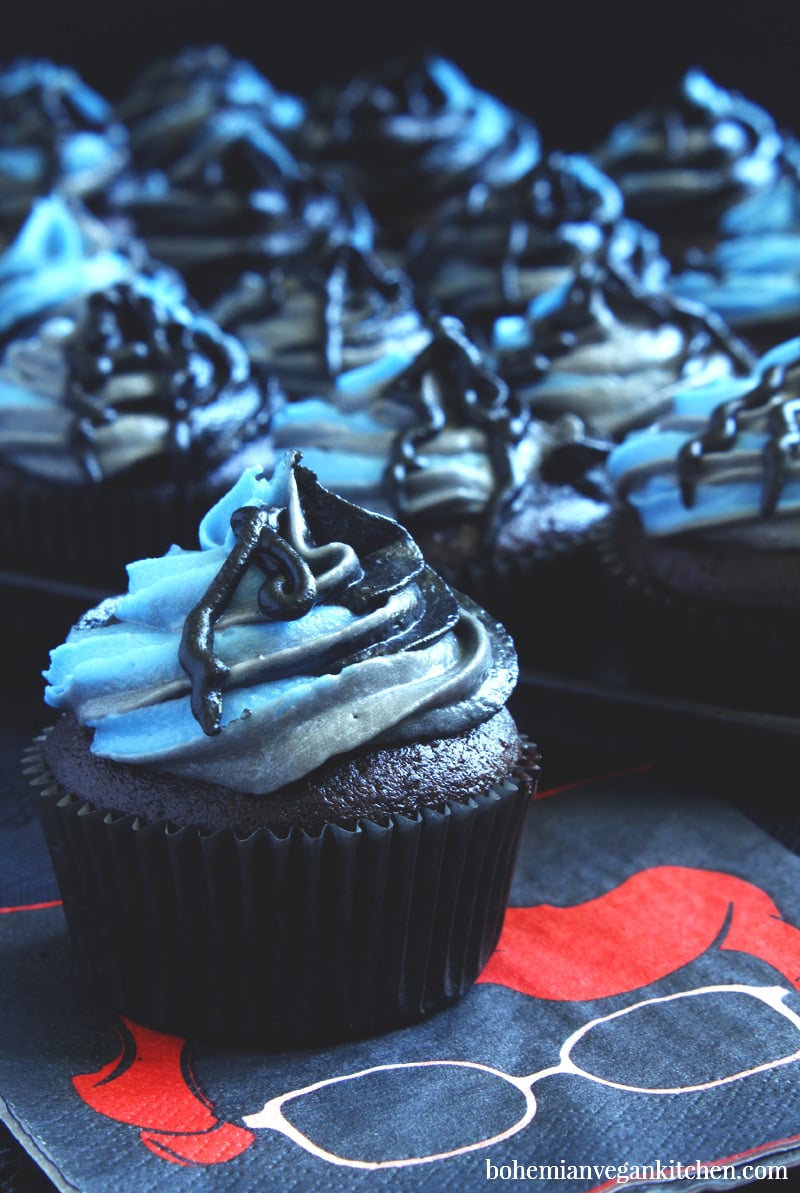 Geek out at any birthday party or Halloween gathering with these easy Stranger Things cupcakes! Naturally vegan, these cupcakes come in classic vanilla Joyce Christmas lights and dark chocolate Upside Down (R.I.P. Barb). Sure to satisfy both vanilla and chocolate lovers! #veganstrangerthings #strangerthingscupcakes #strangerthingscupcakeideas #halloweencupcakes #veganhalloweenrecipes #veganhalloweenfood #bohemianvegankitchen