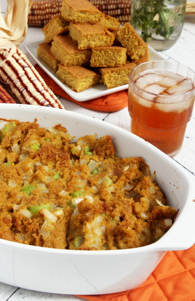 picture of vegan cornbread stuffing in a casserole dish with tea