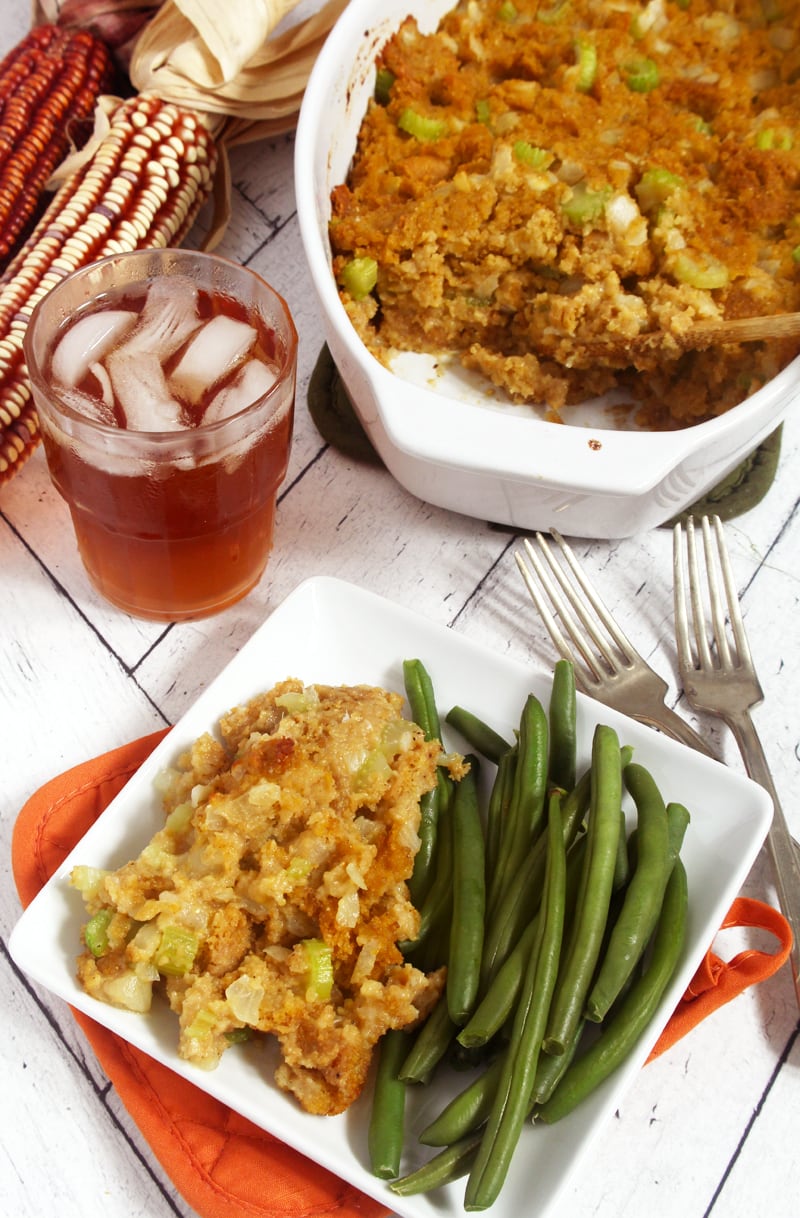 picture of cornbread stuffing on a plate with green beans