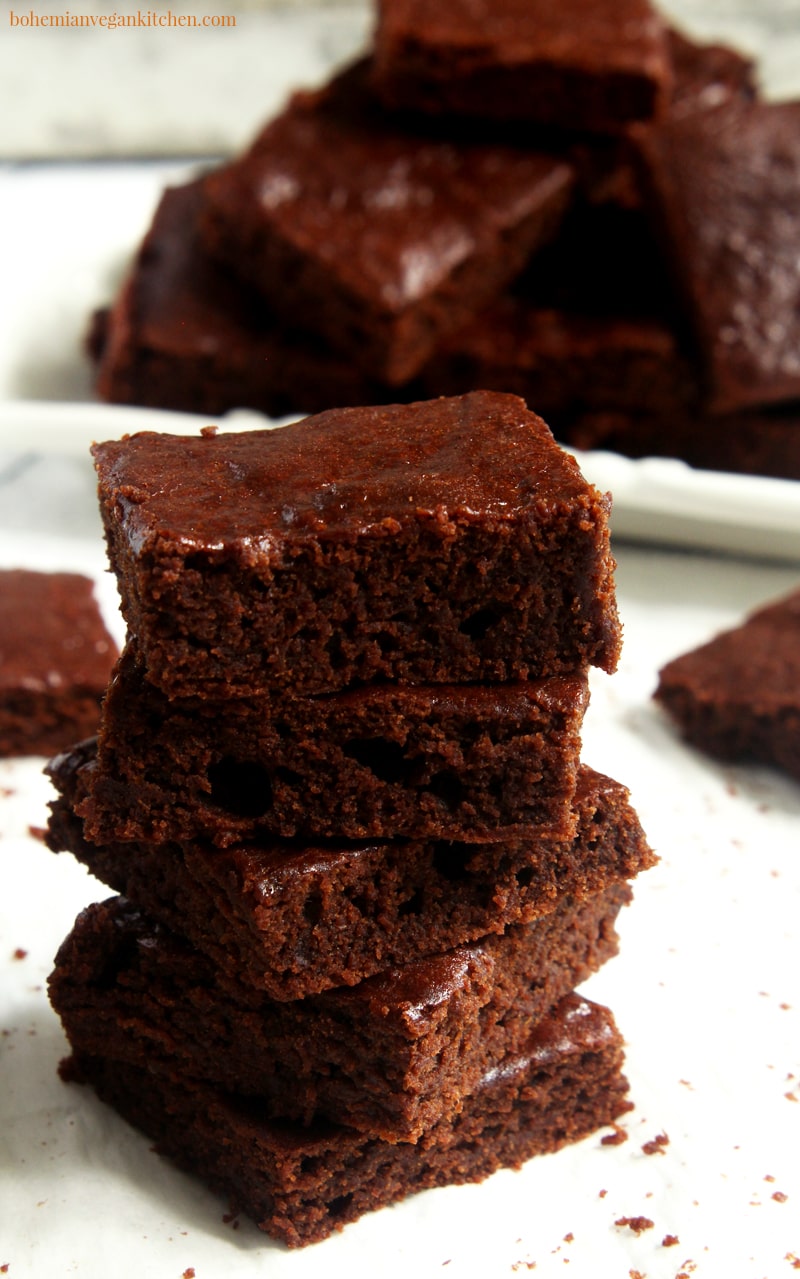 Reward yourself today with these fudgy, moist, and QUICK vegan pumpkin brownies! Taking only 10 min prep and 15 min to bake, these brownies are the MESSIAH of the conventional brownie, because they bring in the heavenly taste of pumpkin spice and rich cacao that is like an answer to all your brownie prayers. #veganpumpkinbrownies #veganpumpkinbrownieseasy #veganpumpkinbrownieshealthy #veganpumpkinrecipes #veganbrownieseasy #veganbrownies #bohemianvegankitchen