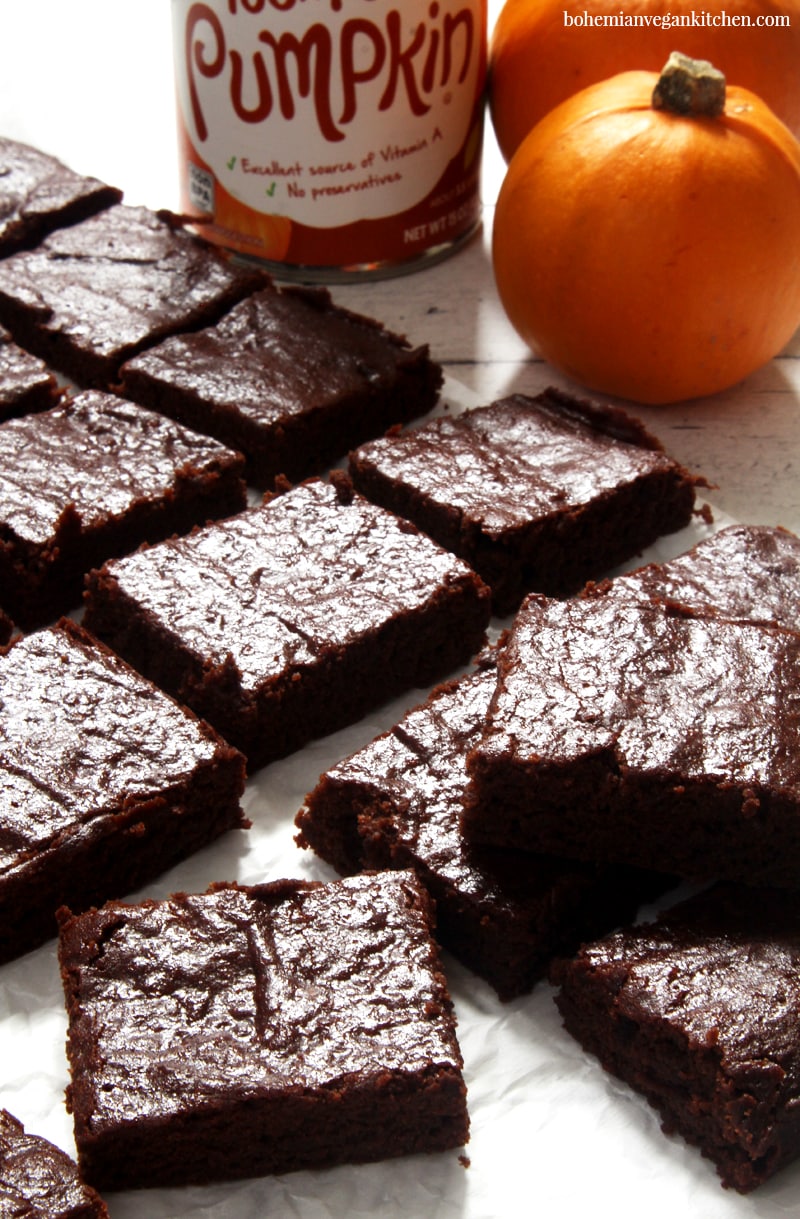 Reward yourself today with these fudgy, moist, and QUICK vegan pumpkin brownies! Taking only 10 min prep and 15 min to bake, these brownies are the MESSIAH of the conventional brownie, because they bring in the heavenly taste of pumpkin spice and rich cacao that is like an answer to all your brownie prayers. #veganpumpkinbrownies #veganpumpkinbrownieseasy #veganpumpkinbrownieshealthy #veganpumpkinrecipes #veganbrownieseasy #veganbrownies #bohemianvegankitchen