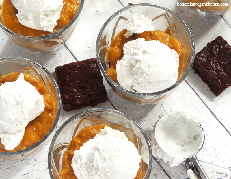 Forget the pumpkin pie this year and have this simple vegan trifle instead! Loaded down with thick layers of fudgy pumpkin brownies, creamy pumpkin spiced pudding, and smooth coconut whipped topping, this trifle is sure to wow your guests this Thanksgiving! #vegantrifle #vegantrifledesserts #vegantriflerecipe #vegantriflechristmas #veganthanksgivingdessert #veganthanksgivingrecipes #bohemianvegankitchen 