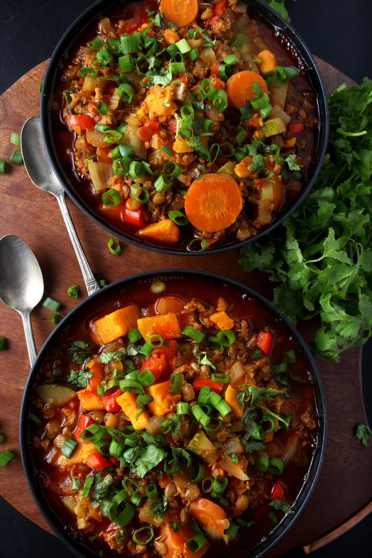 Sometimes you just want comfort food, like this easy vegan chili recipe. Simple to make, this healthy vegan chili is loaded down with a variety of vegetables. But there's a twist: no tomatoes! Completely gluten-free and totally flexible, this chili makes the perfect weeknight dinner. #veganchilirecipe #veganchilieasy #veganchilihealthy #vegansouprecipes #veganweeknightdinners #easyveganrecipes #bohemianvegankitchen