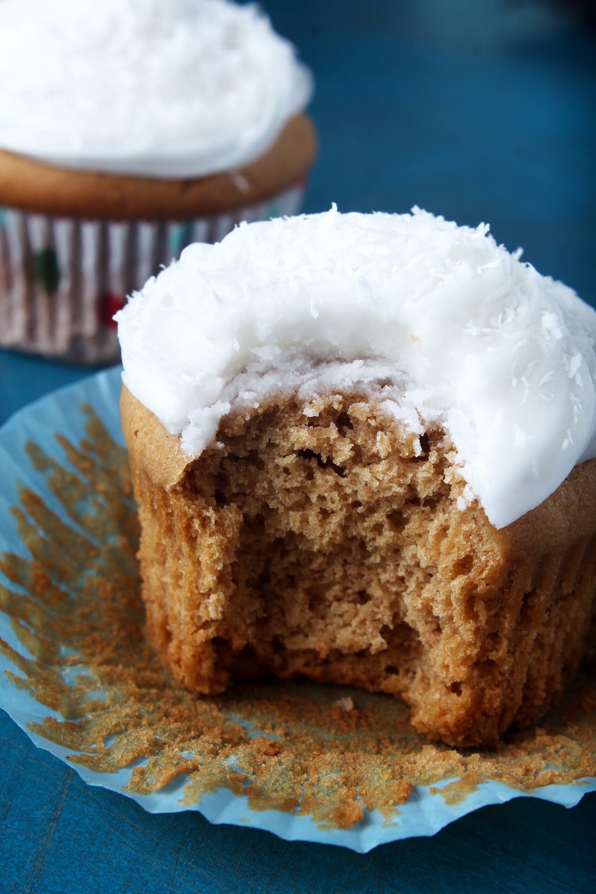 These coconut cupcakes are so delicious, no one will know they're vegan! Made using creamy coconut milk + topped with smooth coconut frosting, these cupcakes are a snap to make. #coconutcupcakes #coconutcupcakeseasy #vegancoconutcupcakes #veganeasterrecipes #vegancupcakesrecipe #vegancupcakeseasy #bohemianvegankitchen