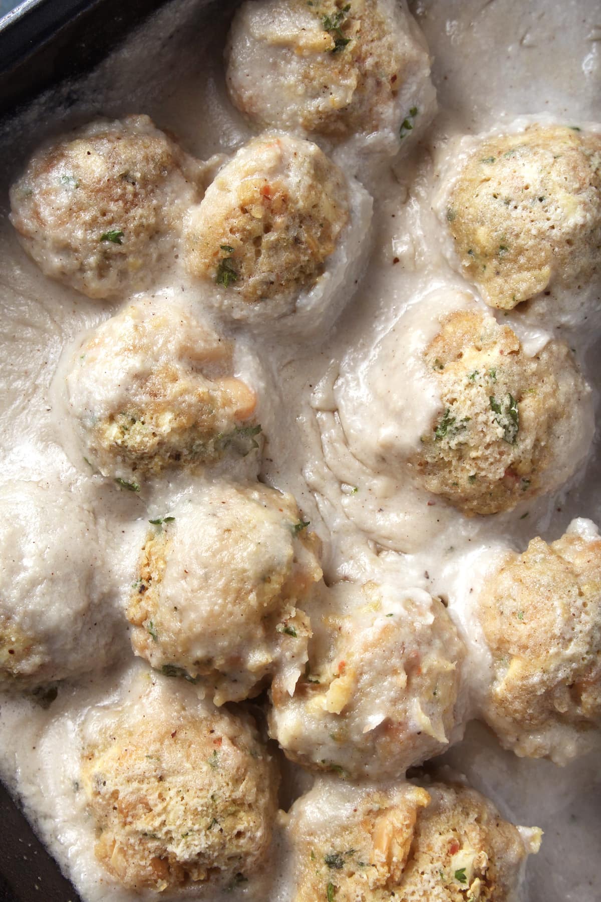 Who says comfort food has to be unhealthy? These vegan Swedish meatballs are not only absolutely delicious, but healthy too! Using ingredients like white beans, oats, and cashews gives this meal a healthy kick while giving you all the comfort feels. #vegancomfortfood #veganswedishmeatballs #veganswedishmeatballsgravy #vegandinner #vegandinnerrecipes #veganmeatballsbeans #bohemianvegankitchen 