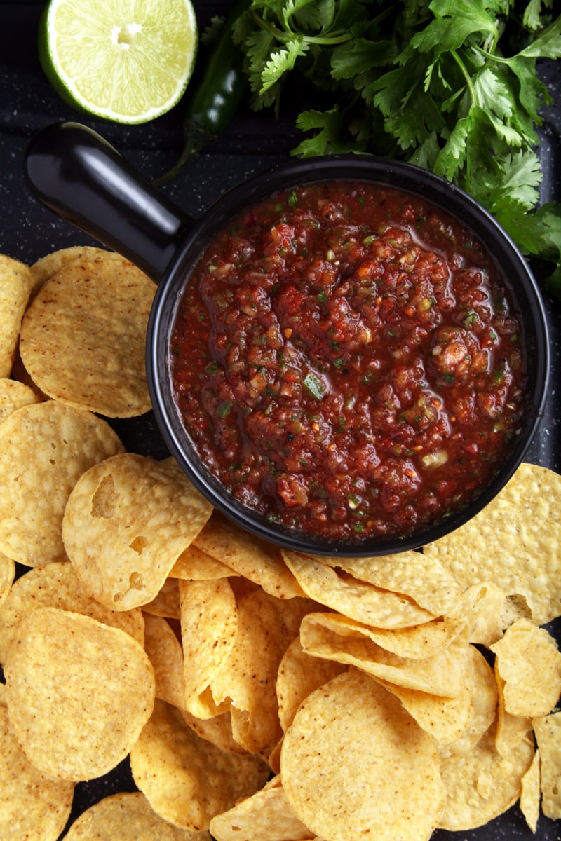 above shot of spicy salsa and tortilla chips.