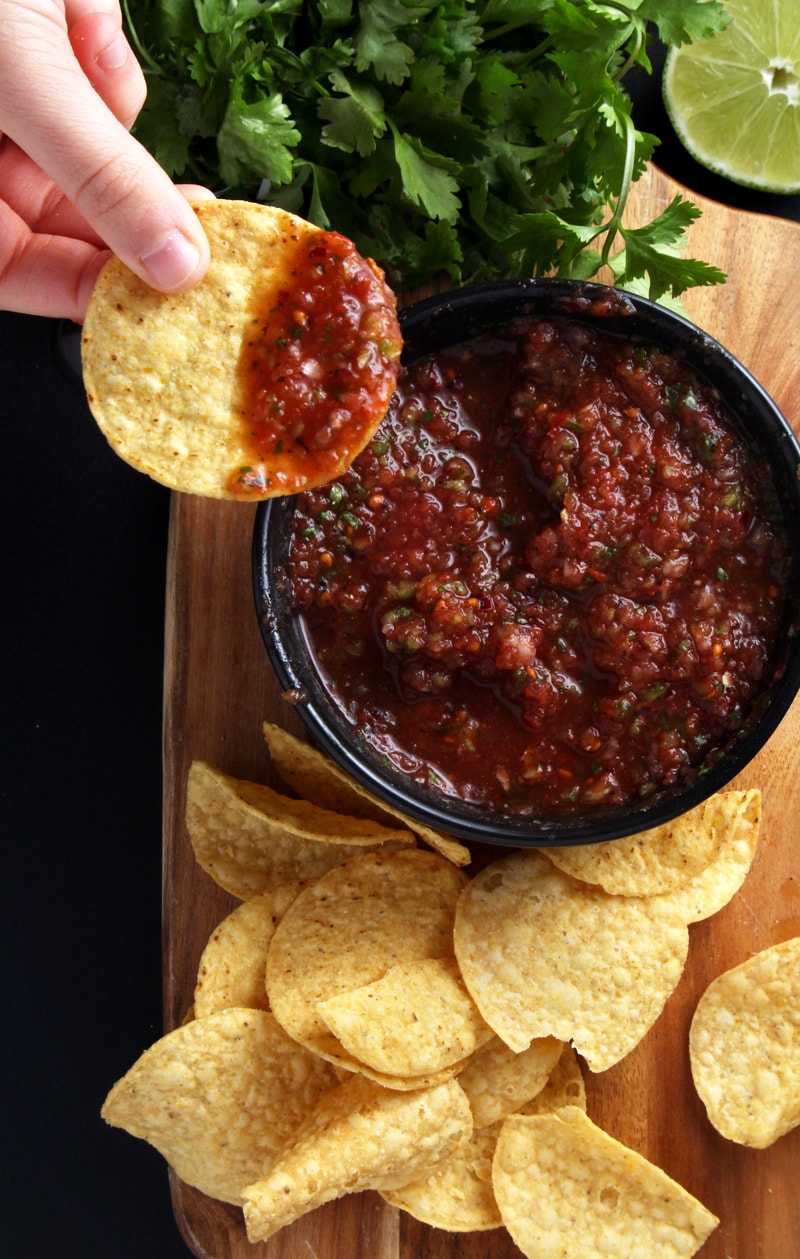 Picture of dipping a chip in salsa. 