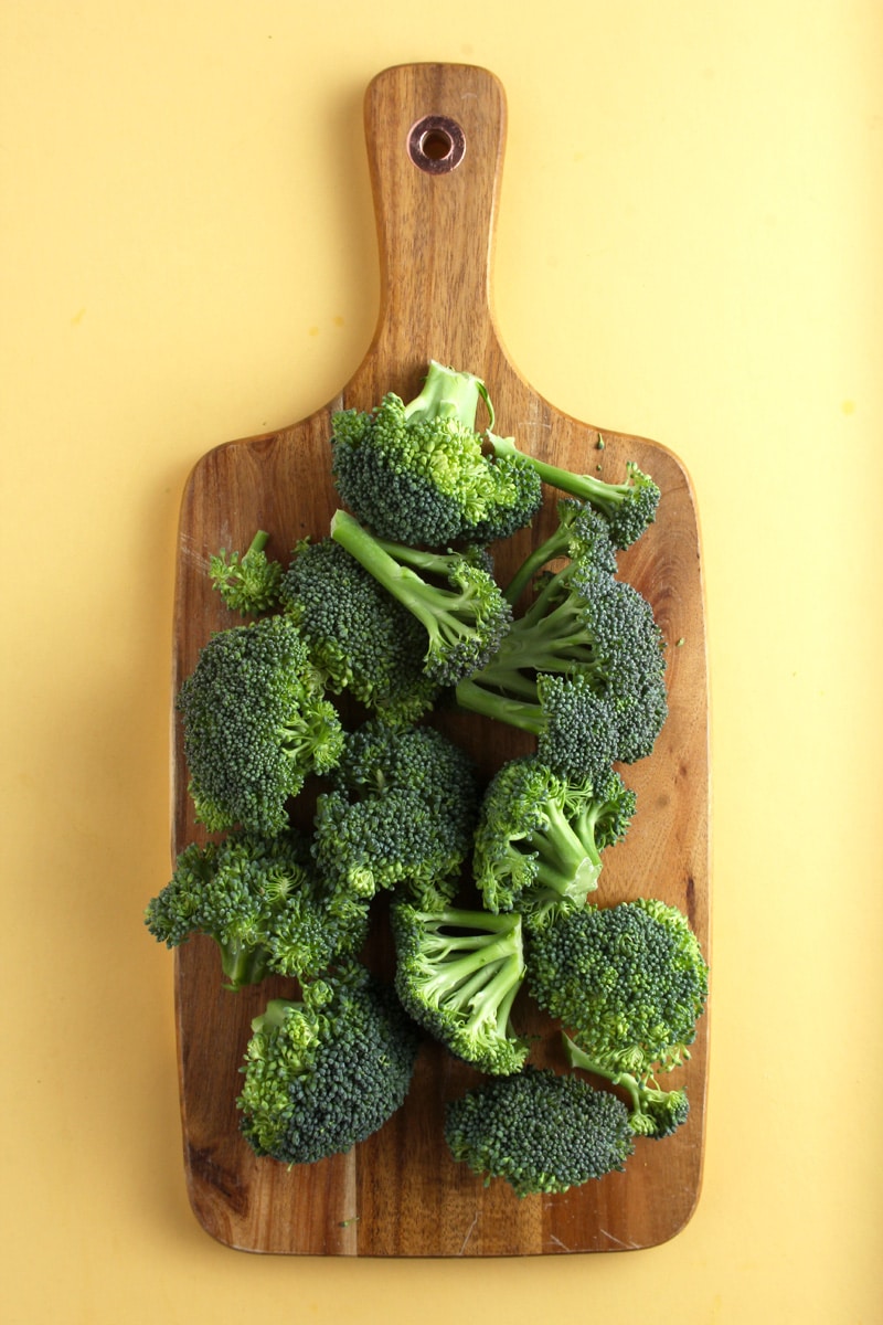 picture of fresh broccoli florets on a cutting board