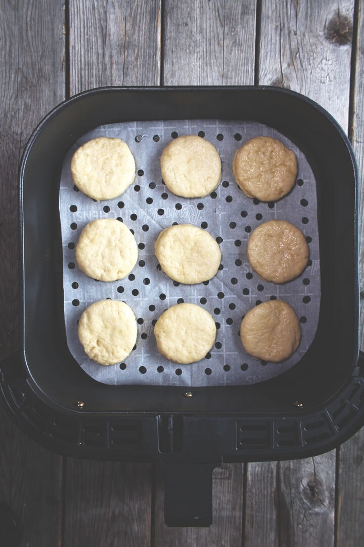 picture of biscuit dough on parchment paper in the air fryer