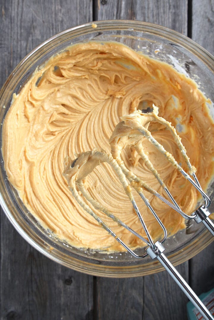 overhead picture of vegan peanut butter frosting whipped with beaters