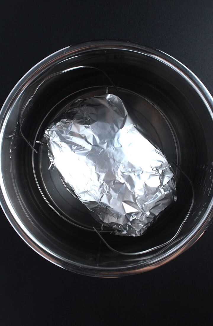 vegan turkey wrapped in tin foil and sitting in instant pot