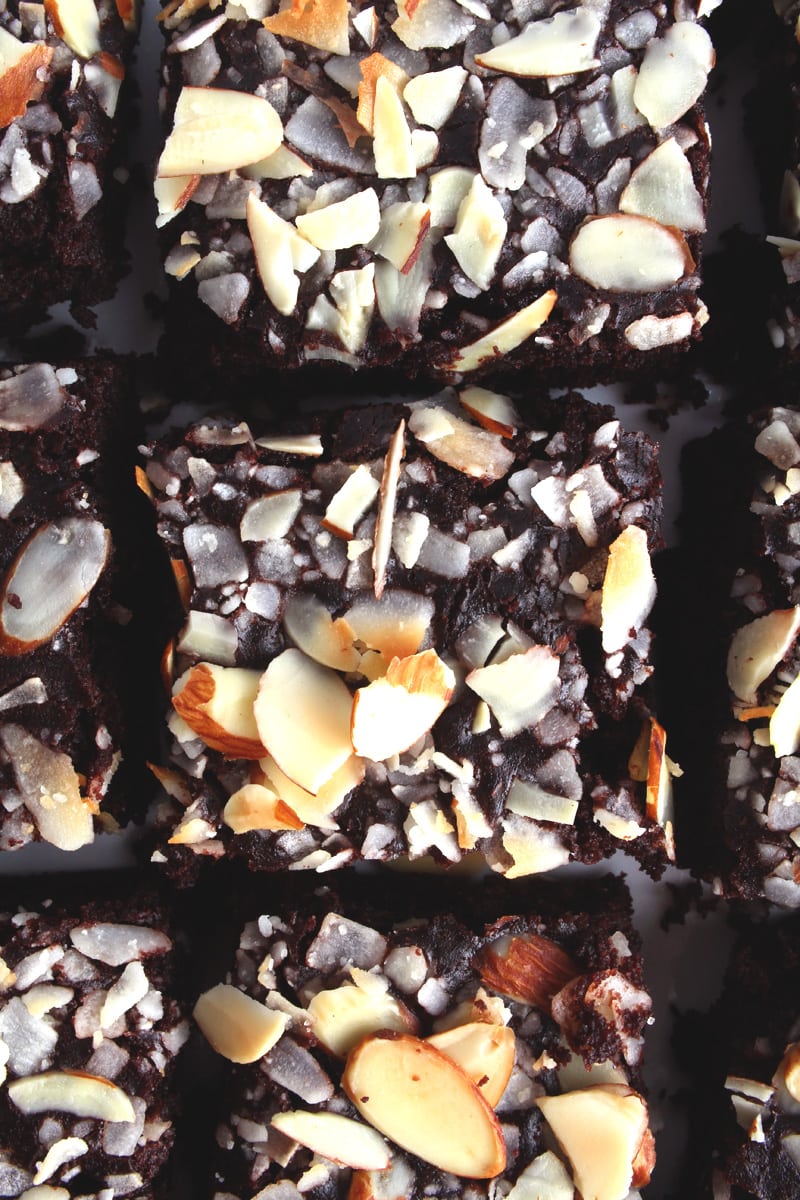 picture of a closeup of almond joy vegan brownies with sliced almonds on top