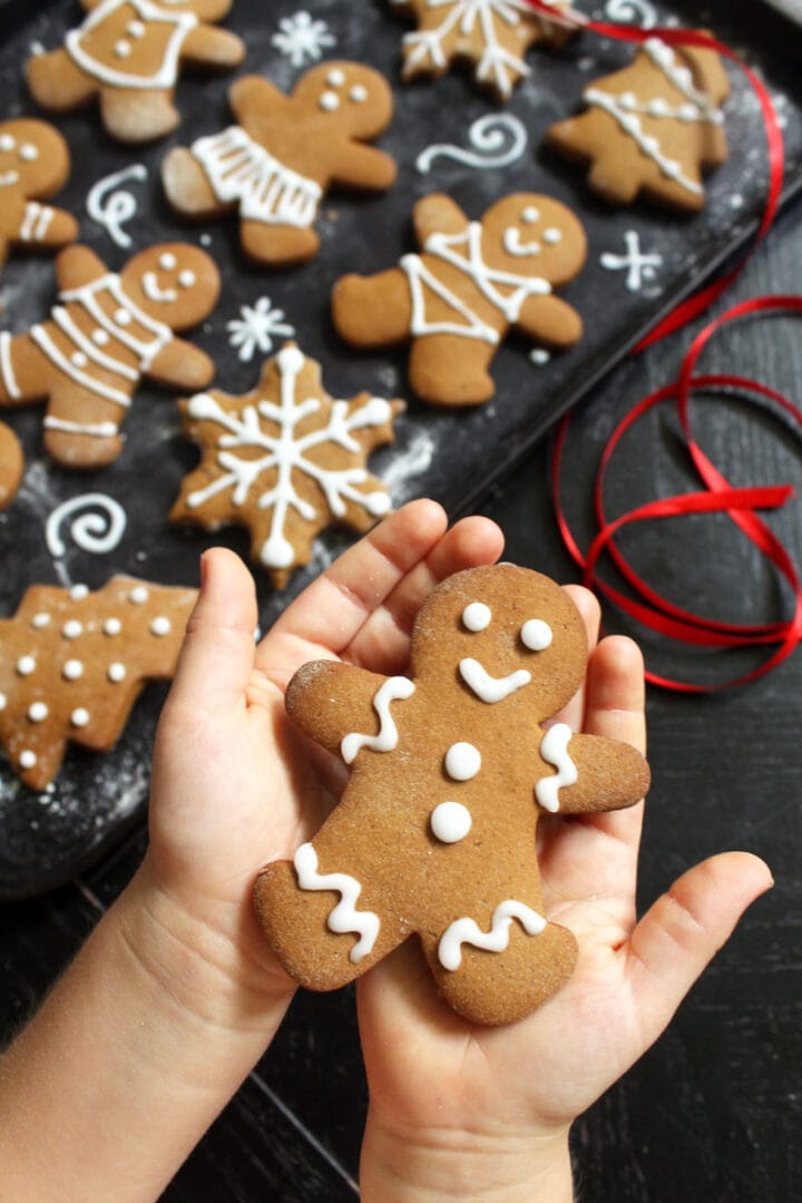 picture of Childs hands holding a gingerbread man