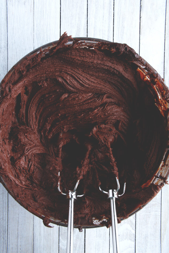 delicious dairy free chocolate ganache frosting whipped in a bowl 